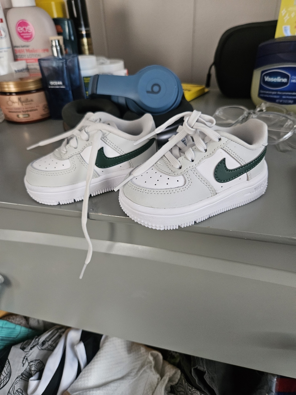Nike Kids White Sneakers with Dark Green Swoosh